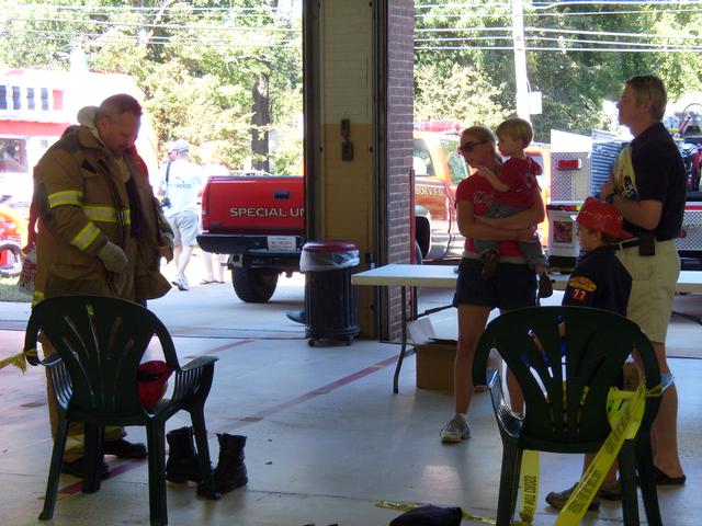 Member Joe Larsen, Sr. demonstrating fire gear at the 2010 Open House